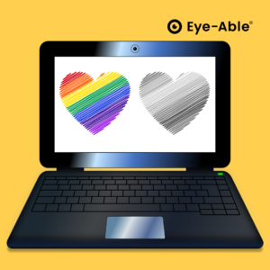 Laptop screen shows a rainbow heart in color and one without color.